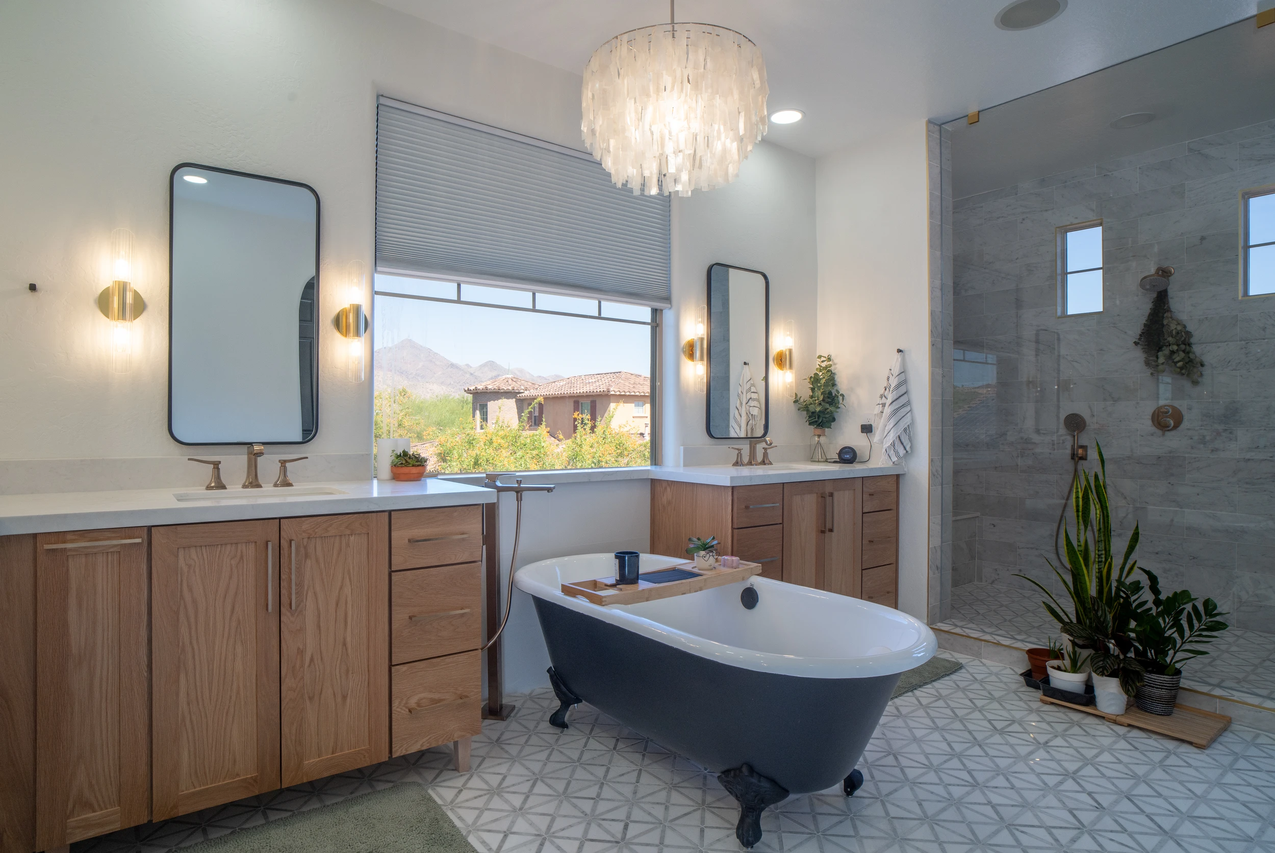 Luxury primary bathroom featuring custom vanities and freestanding soaking tub in Chandler