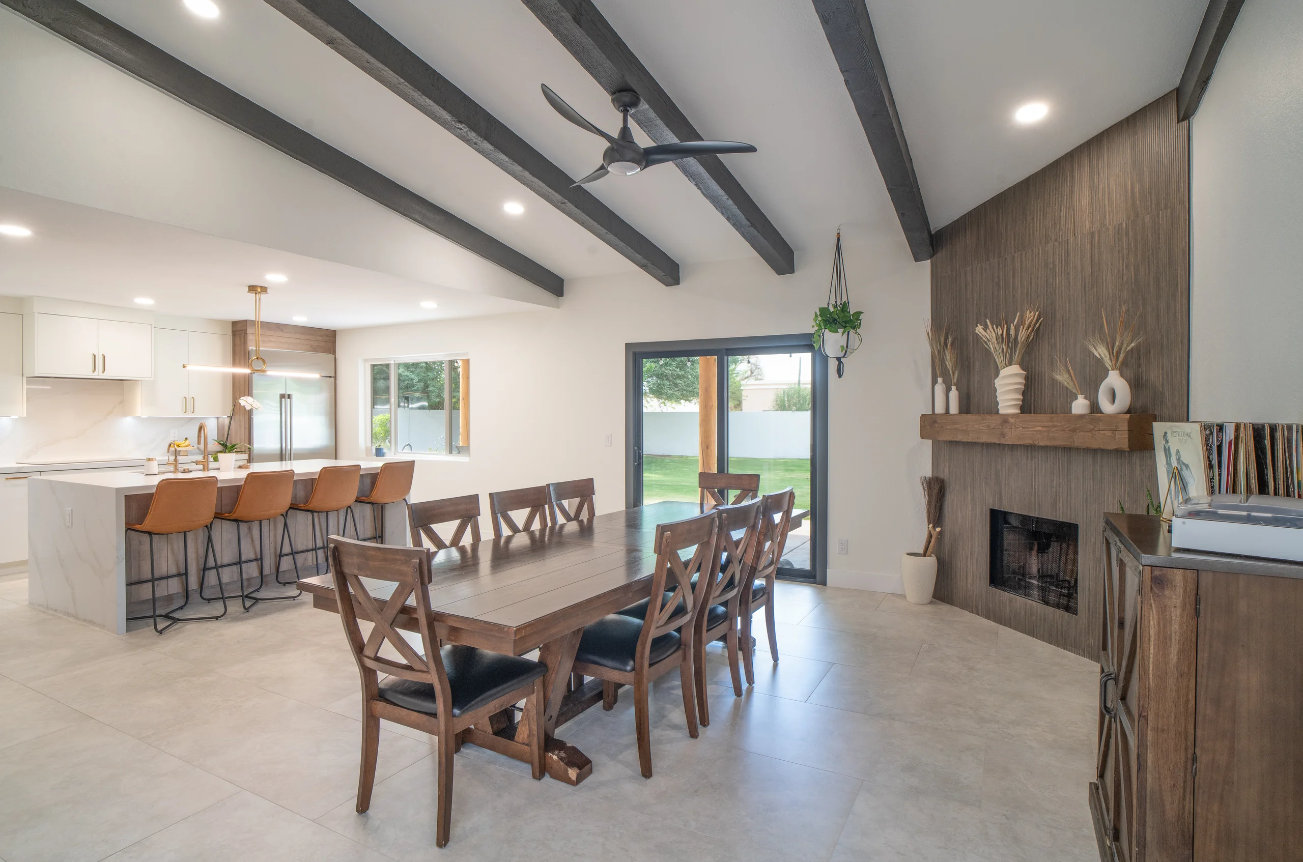 Renovated mid-century modern kitchen and dining room by 123 Remodeling