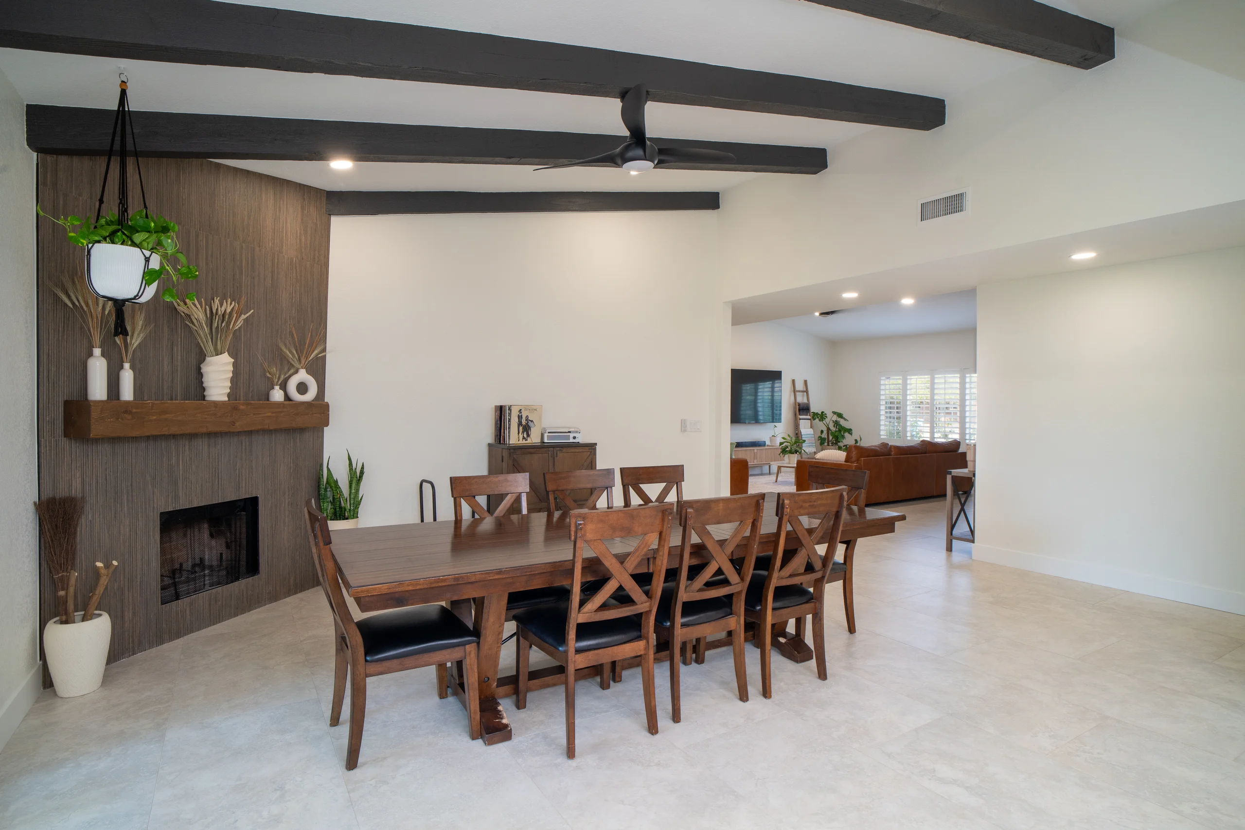 Dining room with dark beams and large table