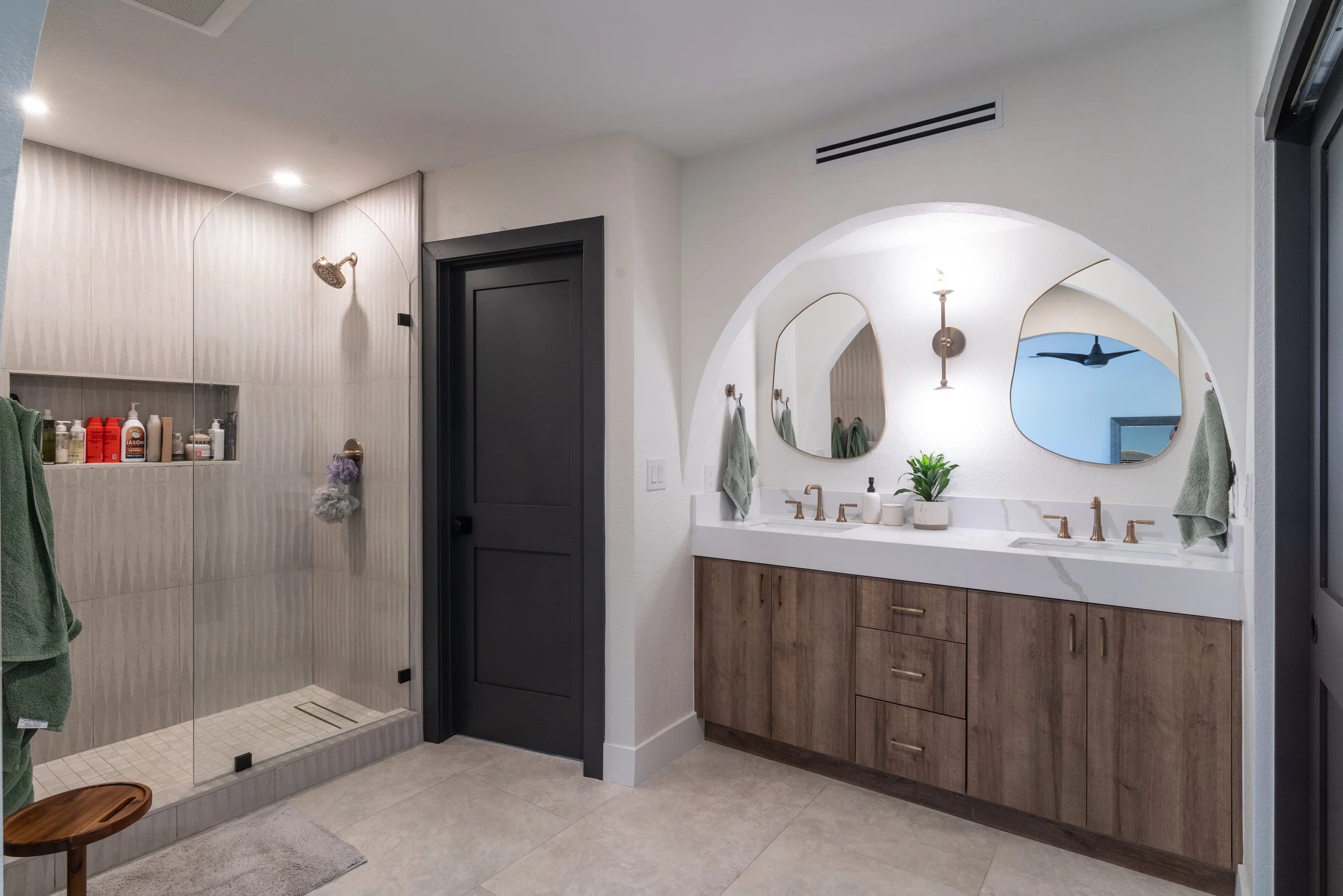 Primary bathroom overview with glass shower