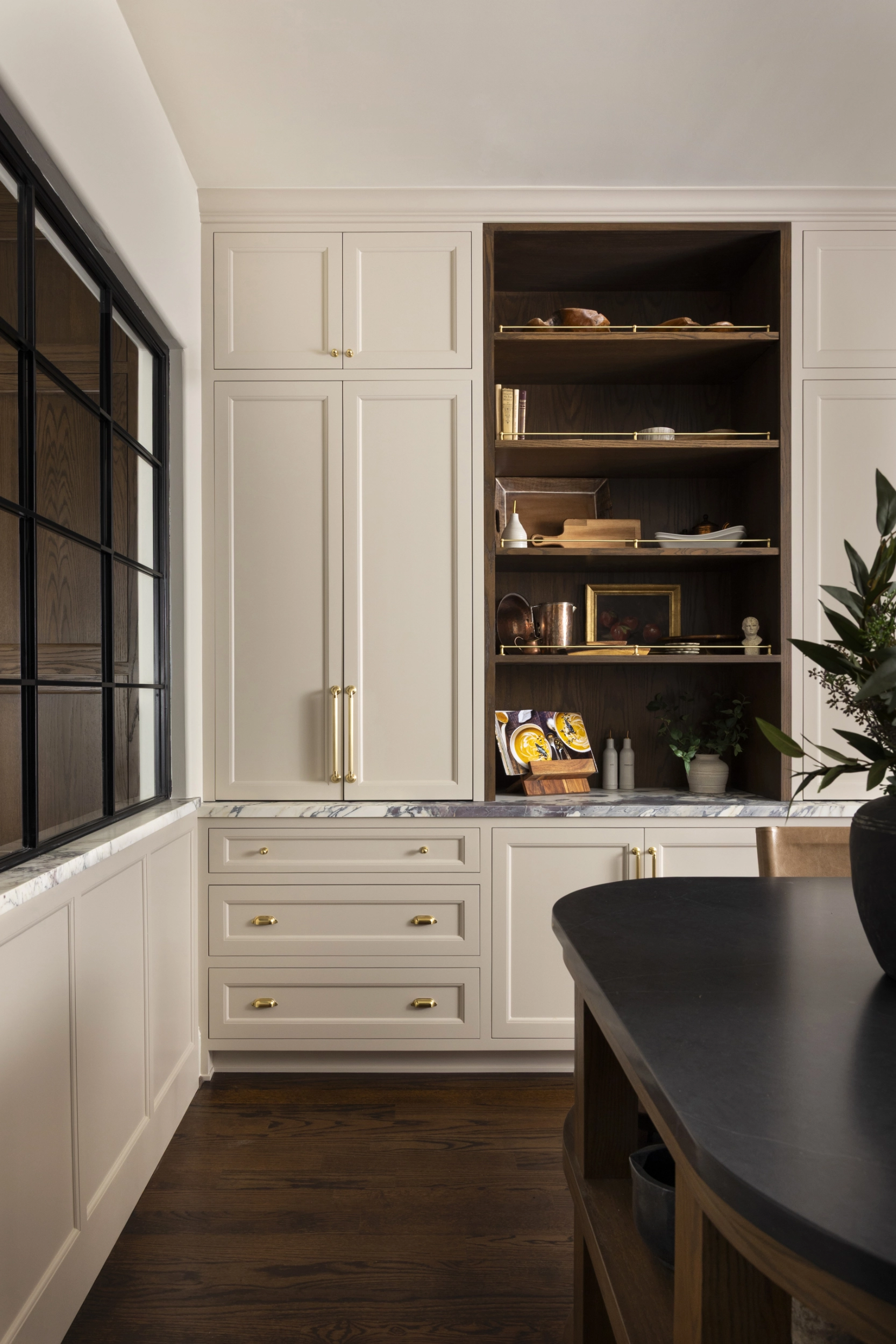 Extra storage cabinets integrated into the kitchen design