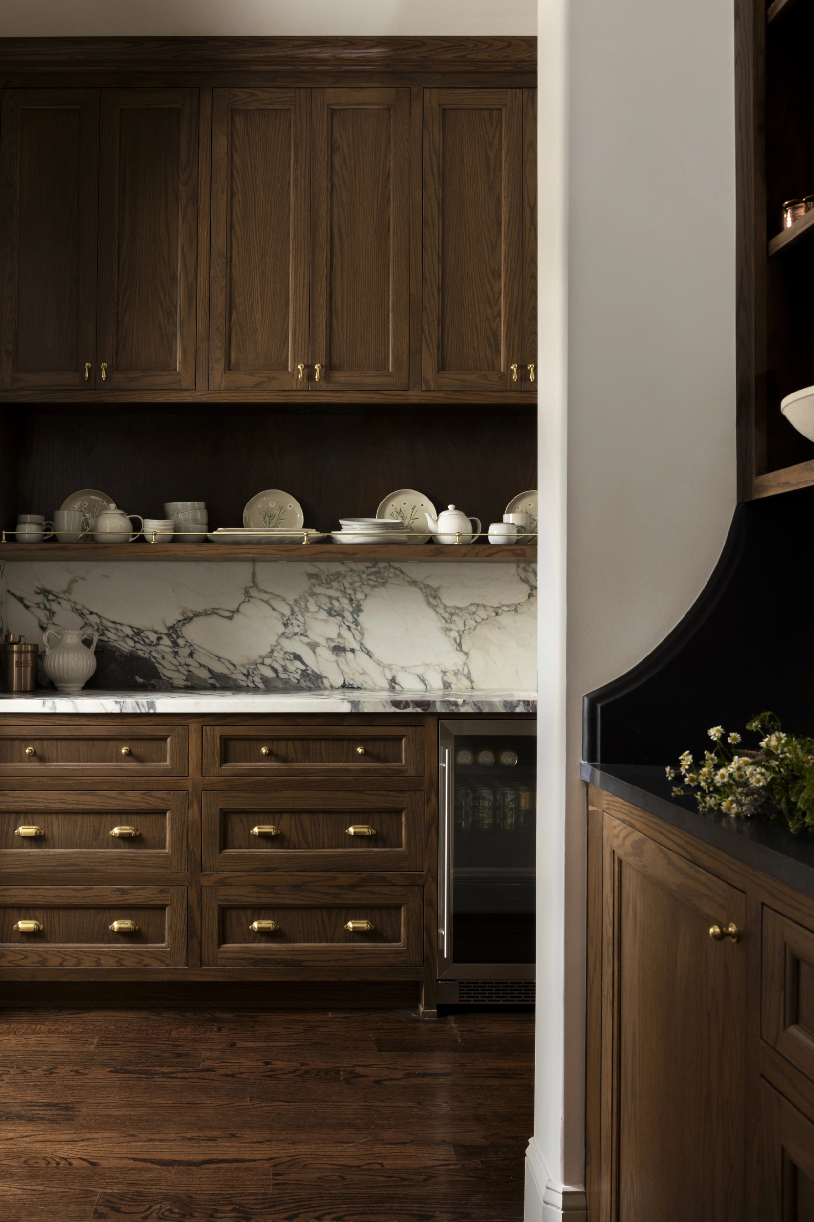 Custom wood kitchen cabinetry along the wall