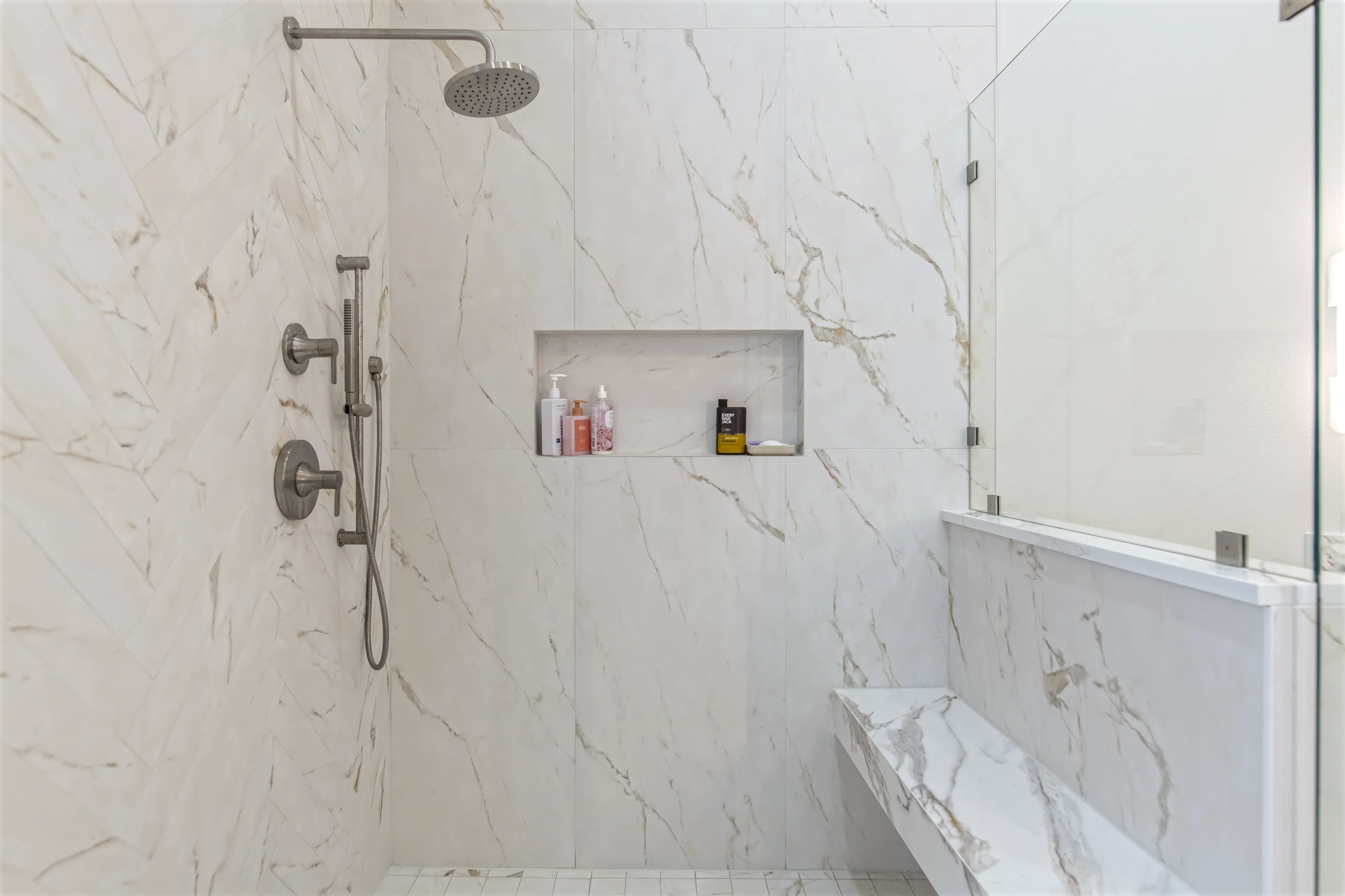 Primary bathroom shower with bench